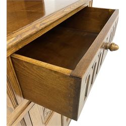Mid-20th century oak dresser, raised two heights plate rack over two drawers and two cupboards