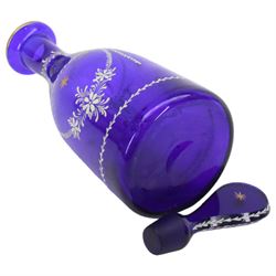 19th century style blue glass decanter and six drinking glasses, the decanter of mallet form with lozenge shaped stopper, all with white enamel and gilt swag decoration, decanter H34cm, drinking glasses H11.5cm