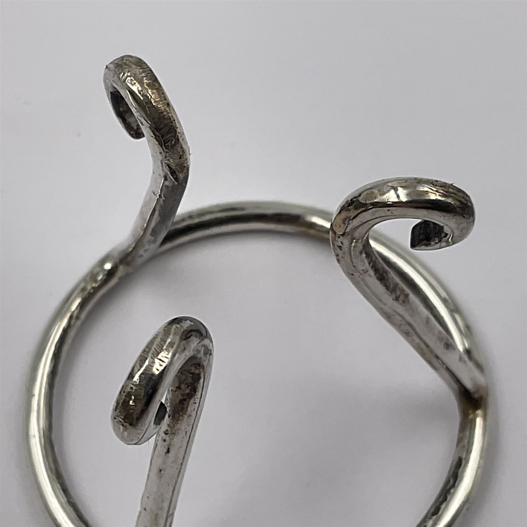 Modern silver limited edition Easter egg, no. 70/500, the openwork lattice body decorated with gilded panels of flower heads, opening to reveal a gilt interior, upon silver stand with three scrolling pad feet, each hallmarked St James House Company, London 1979, height including stand 8cm