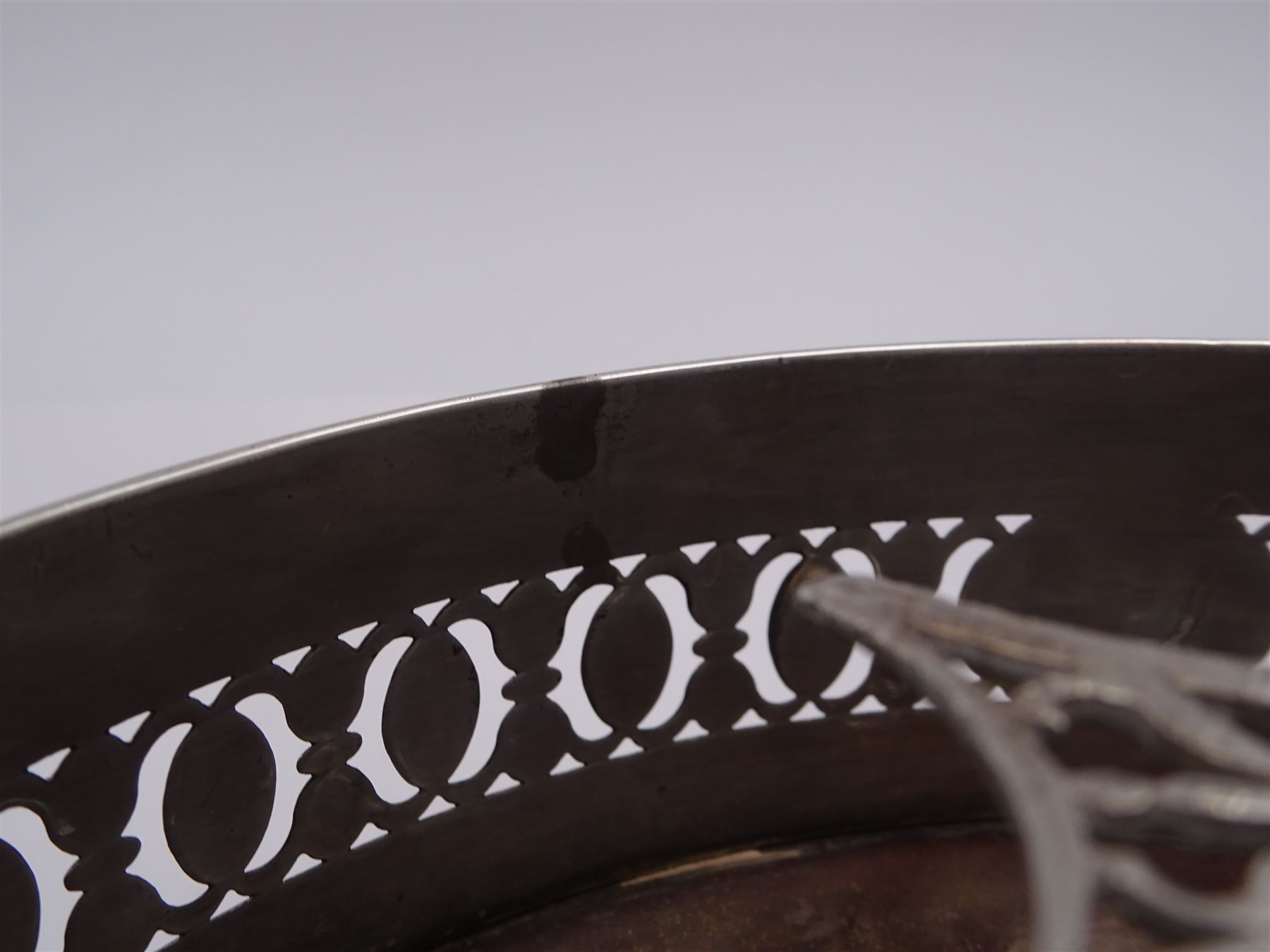 Late 18th century silver cruet stand, of oval form, with pierced sides upon four bun feet, hallmarked to handle Hester Bateman, all other hallmarks indistinct, together with five matched silver mounted cut glass cruet bottles, including some later Victorian examples, hallmarks predominantly indistinct, stand H20cm