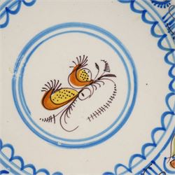 Spanish 18th century majolica bowl, possibly Talvera, decorated with orange flowers among blue decoration on a cream ground, D28cm 