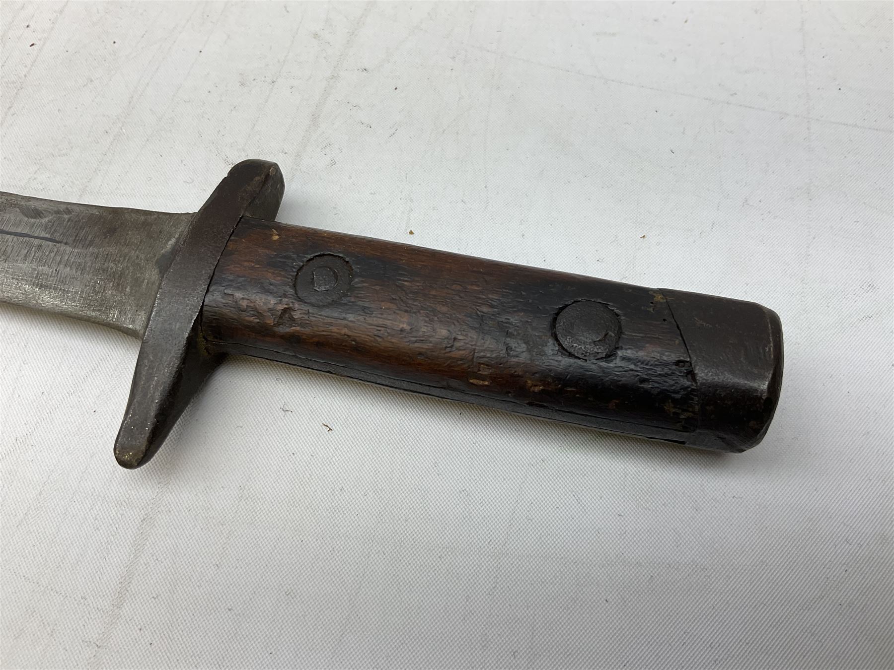 Italian Model 1891 Carcano knife bayonet with 30cm fullered steel blade, the cross-piece stamped VL1110; in steel scabbard with webbing frog L43cm overall; and another Italian fighting knife/bayonet in brass bound leather scabbard (2)