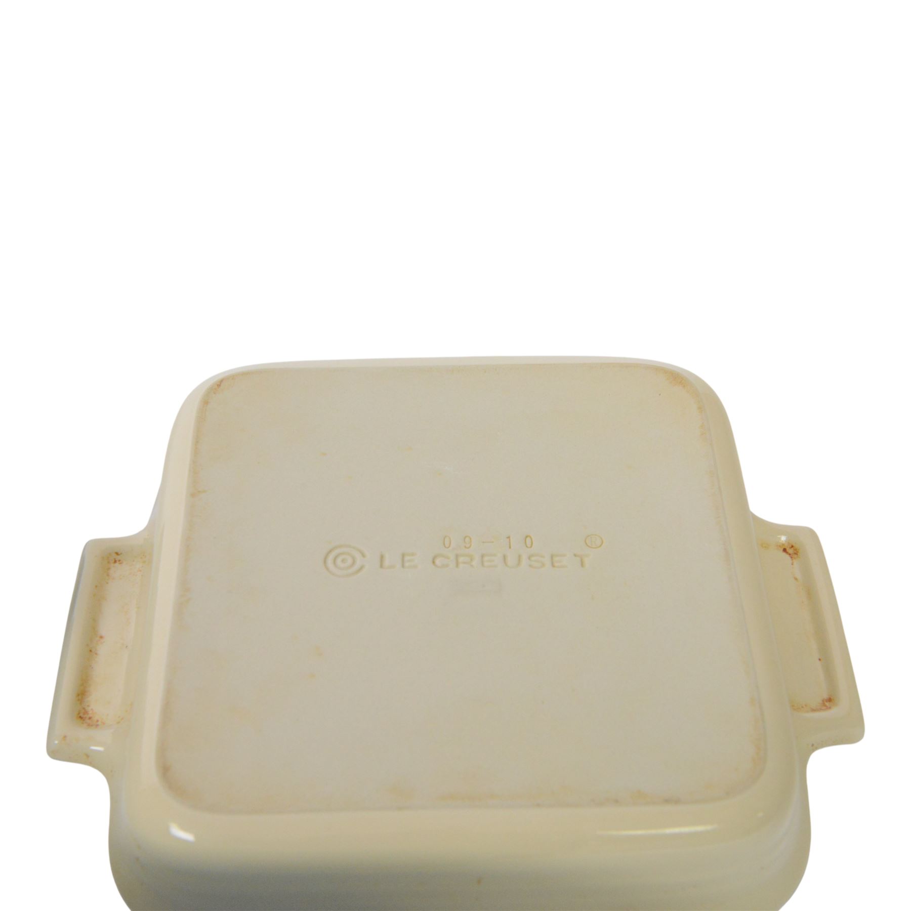 Le Creuset ceramic kitchen wares in cream and light blue, including pie dishes, baking dishes, petit casseroles etc  