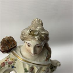 18th century Derby figure of Diana the huntress, circa 1760, modelled reaching for an arrow from quiver across her back, with recumbent hound at her feet, upon a scrolled base with bocage detail, H27.5cm