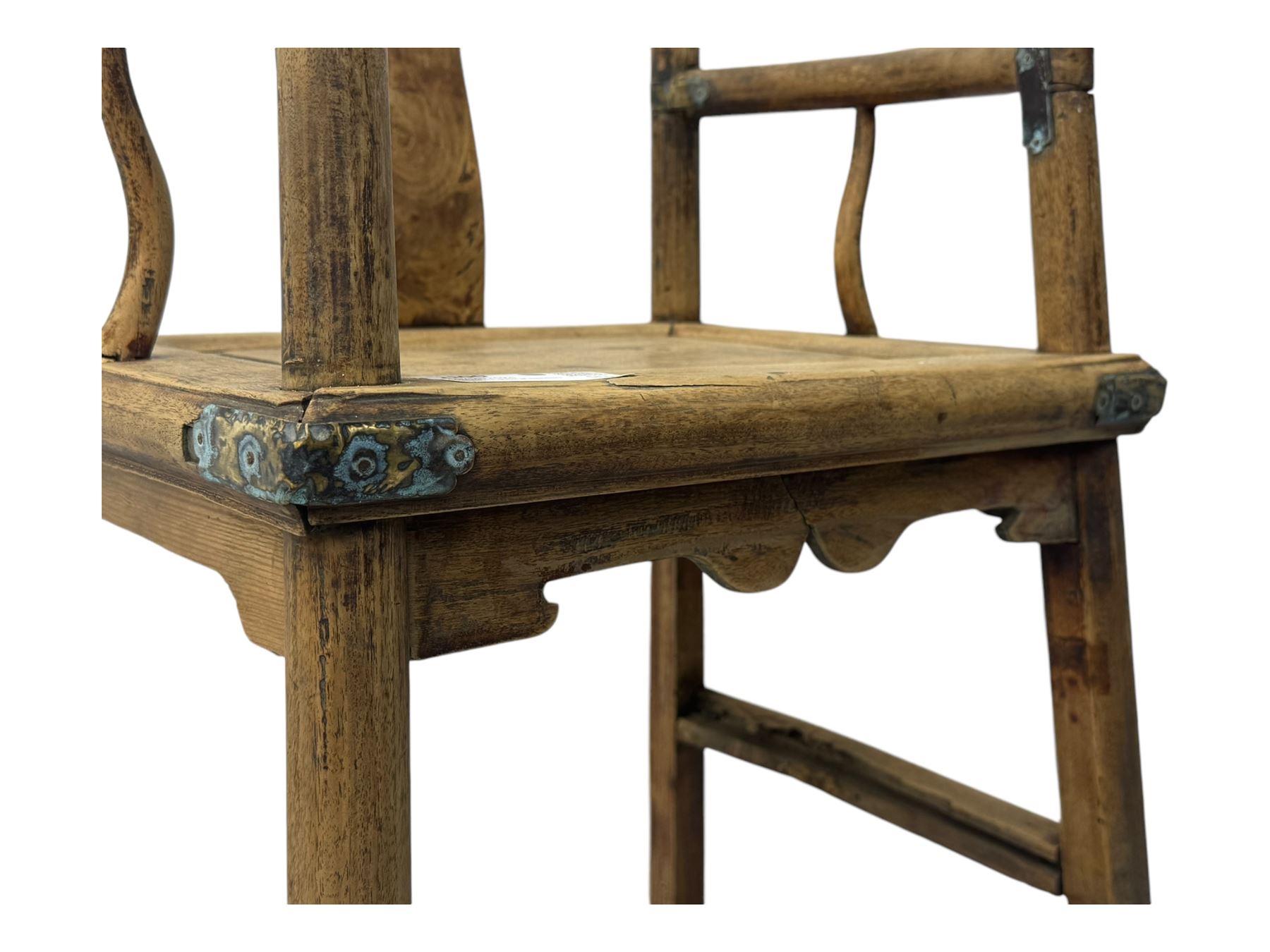 Late 19th century Chinese Qing dynasty high chair, rectangular back with central splat carved with stylised bat motif, applied brasswork to the arms and seat, on rounded supports with double stretcher