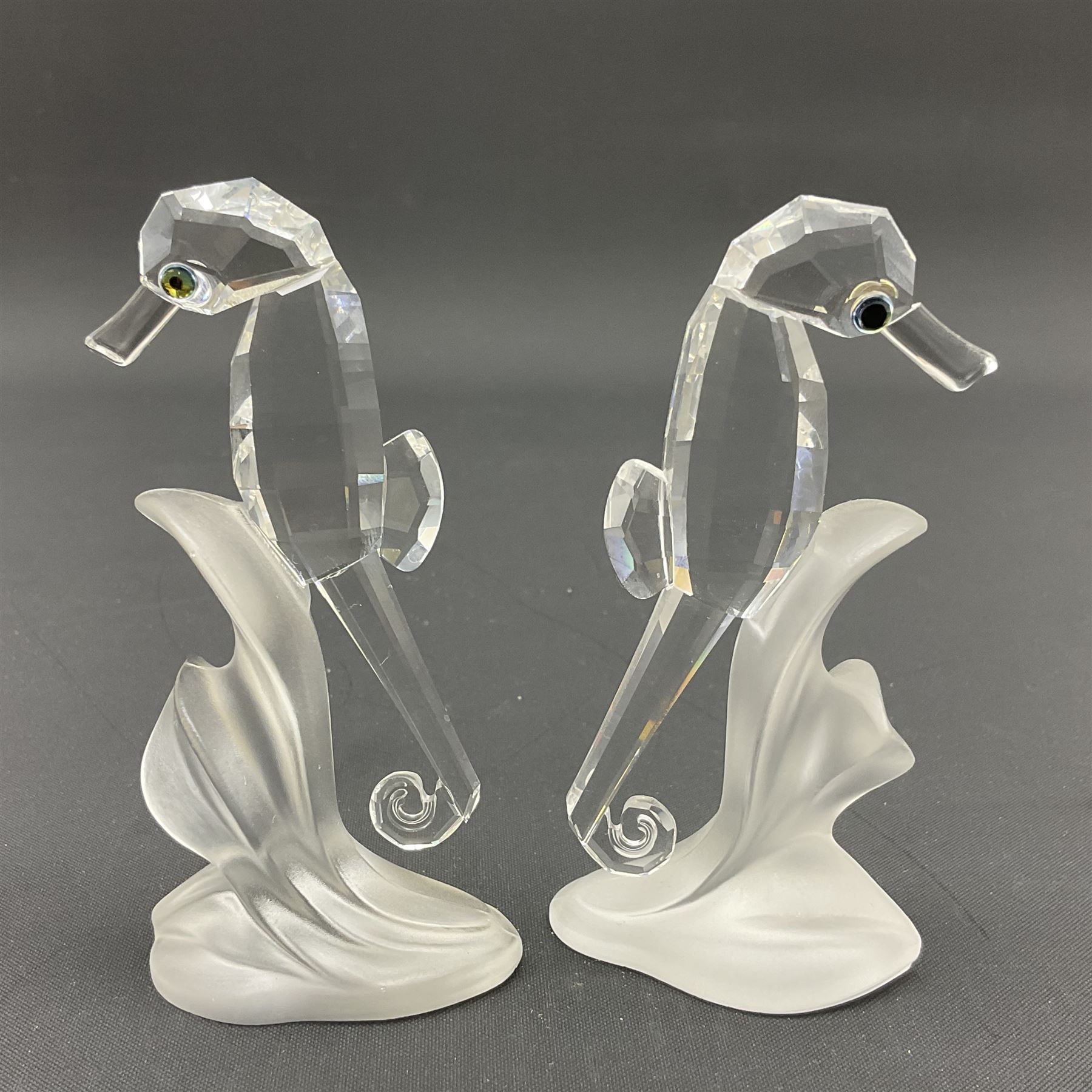 Swarovski Crystal sea creatures, comprising lion fish and dolphin, both with coloured elements, together with two seahorses, two small fish groups, butterfly fish, longnose butterfly fish and six coloured shells, tallest H8.5cm