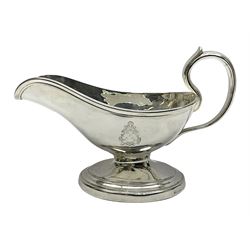 Christofle silver-plated sauce boat, of typical plain form, with capped C scroll handle and engraved anchor crest to body, upon a stepped oval foot, stamped 22 Christofle to base, including handle H14cm