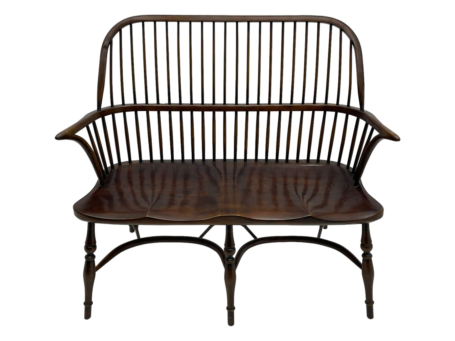 Traditional elm and oak two seat Windsor bench, high comb and stick back, double dished seat on turned supports joined by two crinoline stretchers