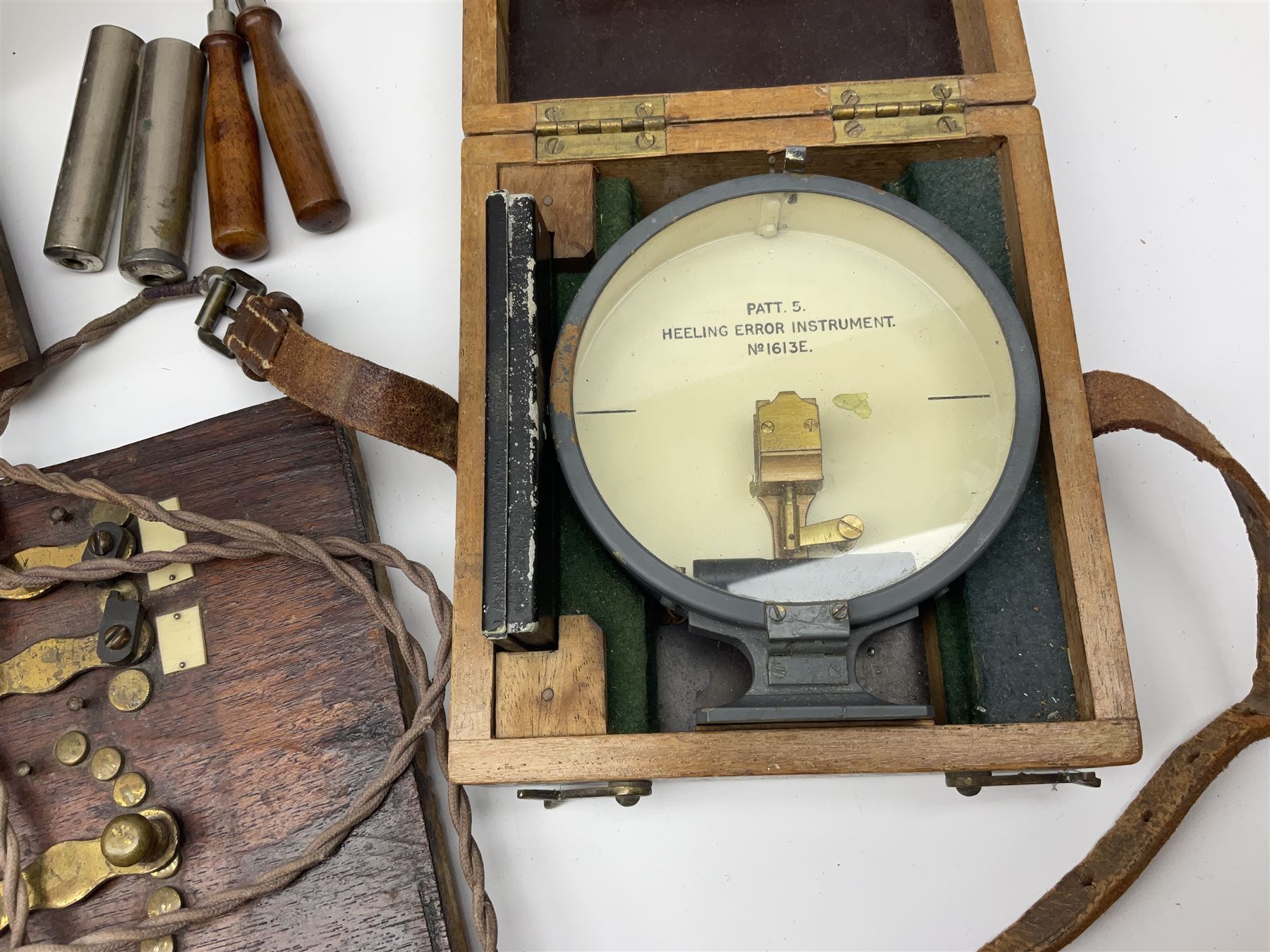 Heeling Error Instrument Patt.5 No.1613E (box numbered 1810E) with integrated spirit level D11cm; two walnut cased electric shock machines; and a similar board mounted electric shock machine (4)
