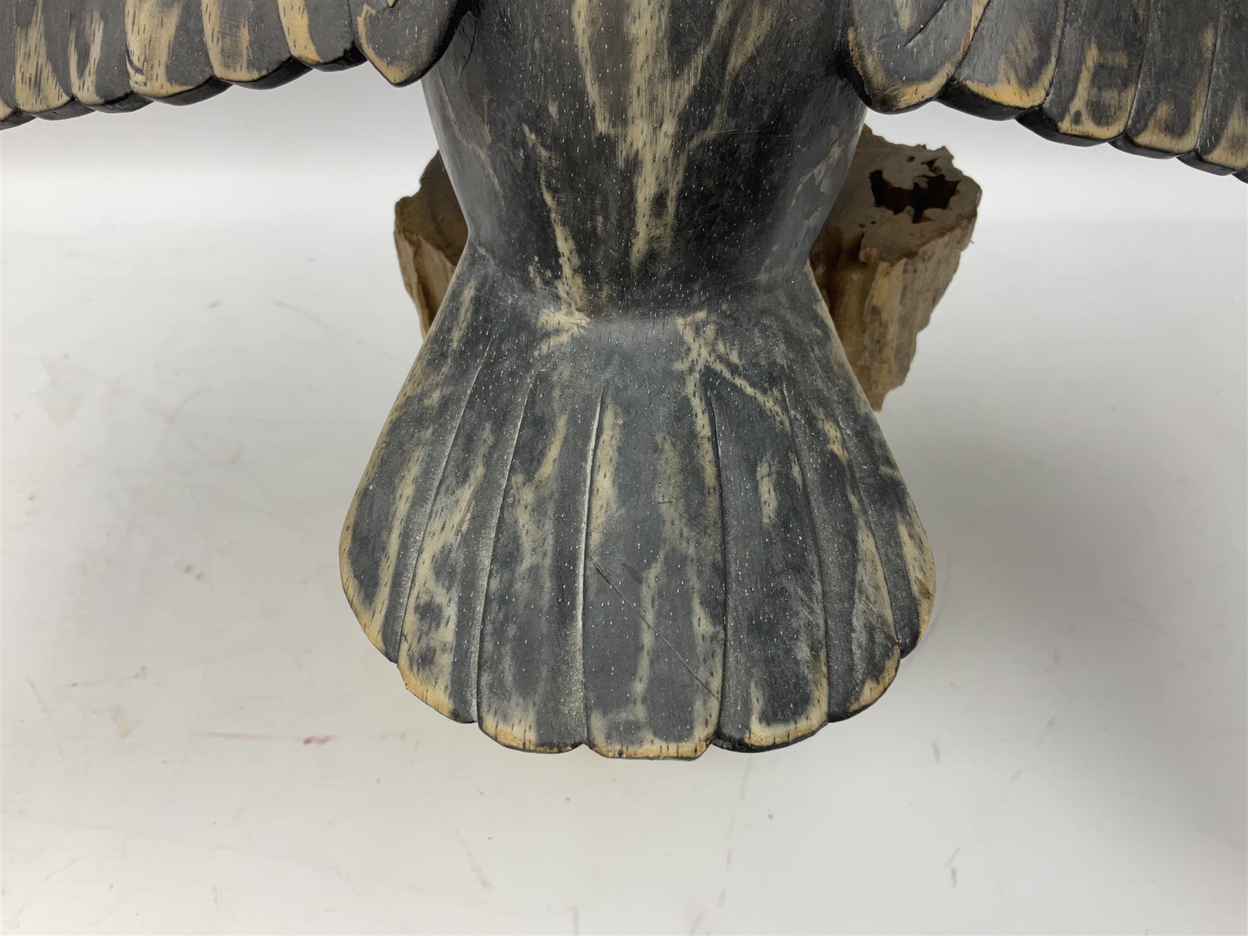 Wooden sculpture of Cormorant aquatic bird on a naturalistic wooden plinth, H46cm