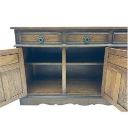 Old Charm Tudor style oak three drawer sideboard