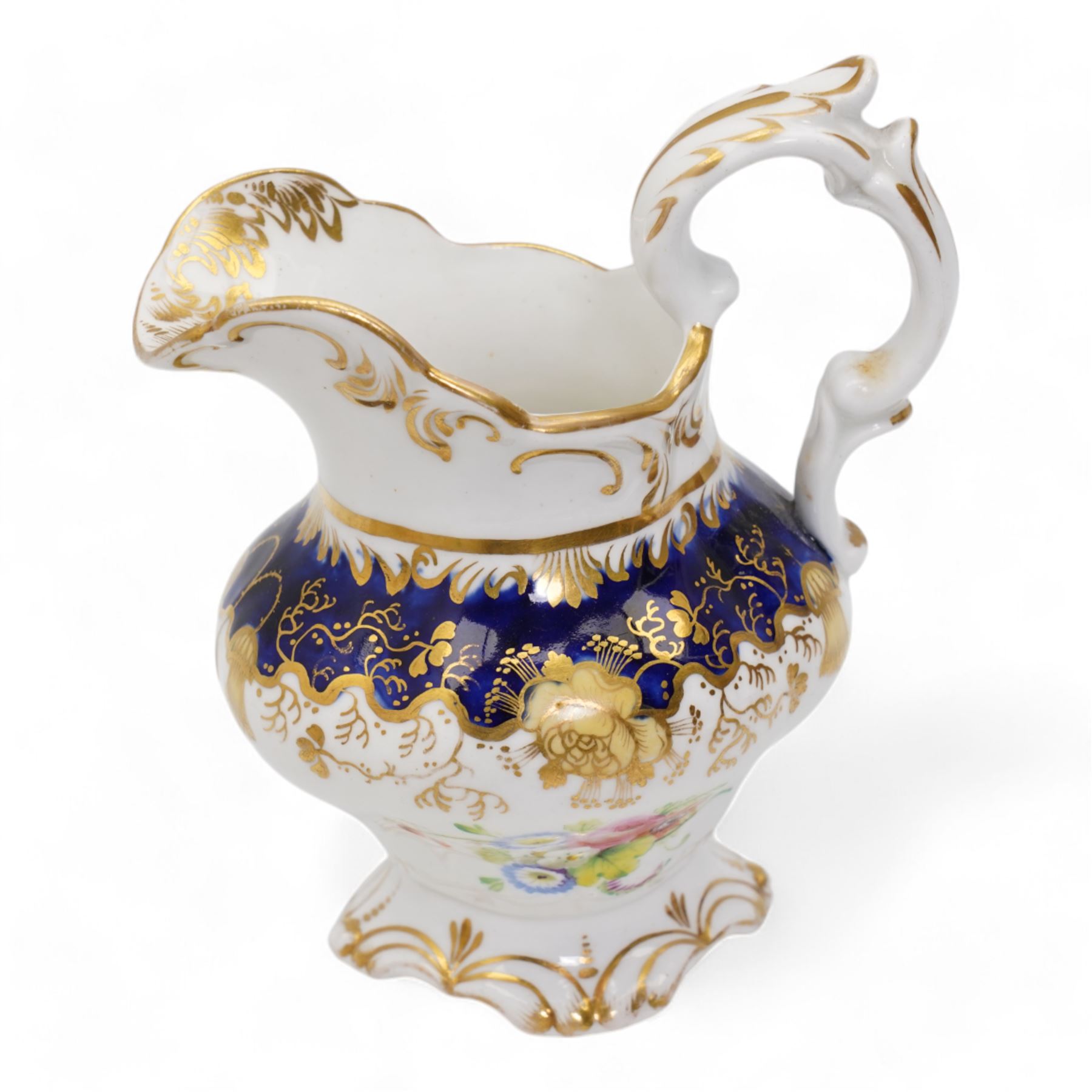 19th century porcelain part tea service, probably Spode, comprising sucrier, milk jug, sandwich plate, seven cups and two saucers, decorated with floral sprays, within cobalt blue and gilt borders, pattern no. 735 