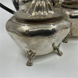 Five piece Edwardian silver tea service, comprising teapot and coffee pot, each with ebonised scroll handle, tea caddy with hinged cover, twin handled open sucrier, and milk jug, each of rounded bombe form, upon four paw feet, hallmarked William Adams Ltd, Birmingham 1904 and 1905, coffee pot H26cm
