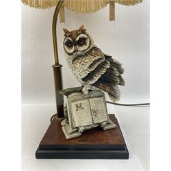 Two Giuseppe Armani figural lamps, the first modelled as an owl perched upon a book, the second modelled as a pair of owls perched upon blackberry branch, each with damask fabric tassel shades, tallest H76cm