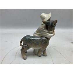 Seven Lladro figures, comprising Playful Puppy no 9135, Platero and Marcelino/Boy Hugging Donkey no 1181, Mini Seal Family no 5318, Attentive Polar Bear no 1207, Seated Polar Bear no1209, Eskimo Boy with Pet no 5238 and Girl with Geese no 1035, together with Nao goose