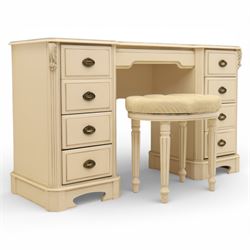 Contemporary French design white painted bedroom suite retailed by Barkers of Northallerton, comprising wide chest fitted with four short and four long drawers with oval brass handles (H 70cm, W 159cm, D 46cm), pair of bedside chests each fitted with three drawers (H 62cm, W 40cm, D 46cm), dressing table fitted with four short drawers and central kneehole with shaped apron (H 79cm, W 131cm, D 46cm) with matching framed wall mounted mirror (H 100cm, W 113cm), and full length standing mirror (H 175cm, W 73cm)