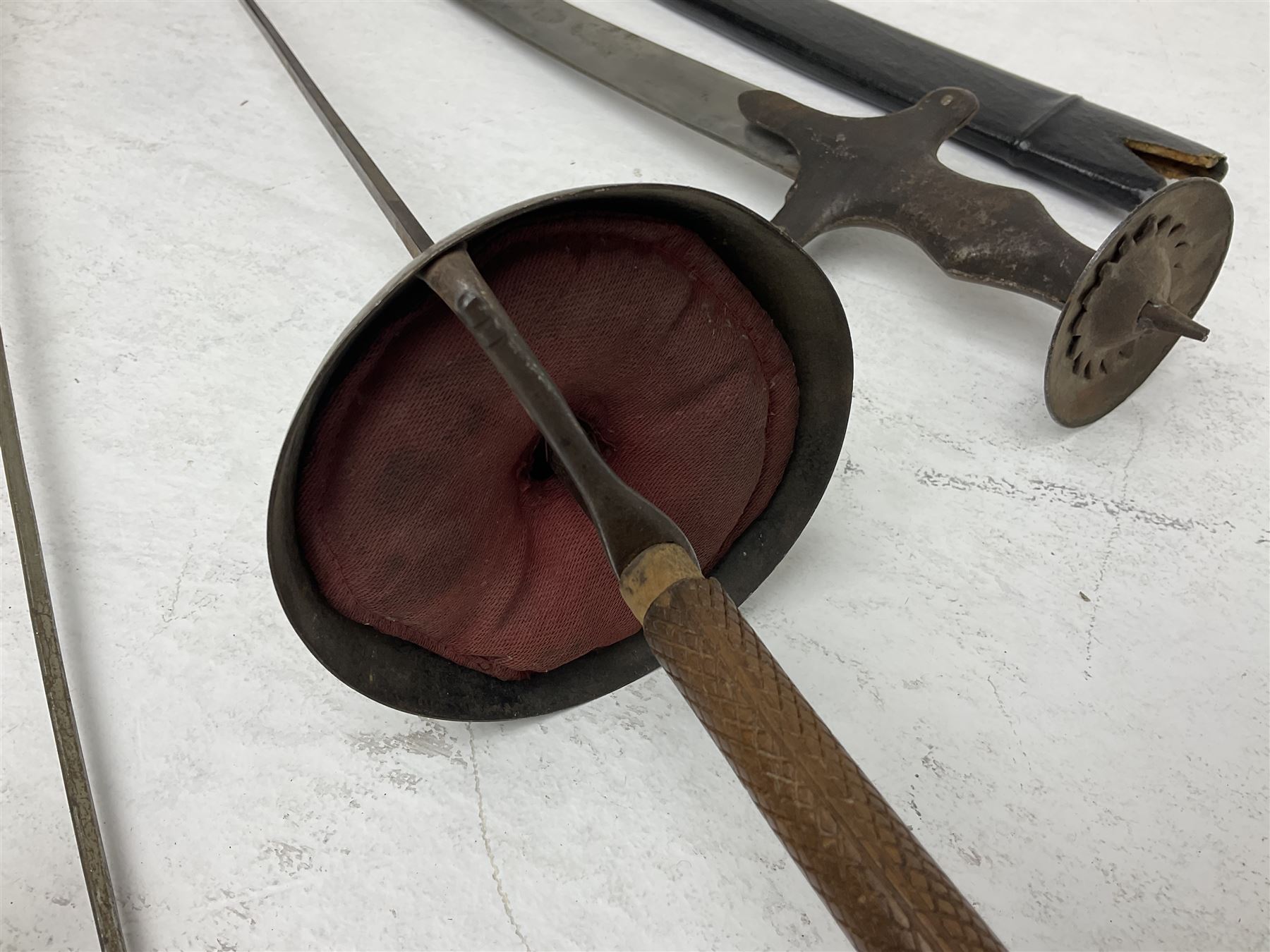 20th century Indian Tulwar sword with 71cm plain curving steel blade and iron hilt with extended langets, knopped grip and spiked pommel; in canvas covered wooden scabbard L87.5cm overall; together with five fencing swords comprising four foils and one epee, three marked Leon Paul, one in carrying case (6)