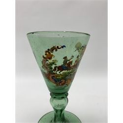 19th century bohemian green glass wine glass, the funnel bowl decorated in enamells with a Historismus hunting scene in the manner of Egermann & Lobmeyr, upon a baluster stem and circular foot, H14.5cm