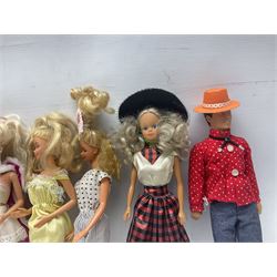 Eleven 1980s fashion dolls, predominantly Barbie/Ken, all dressed; together with some additional clothing.