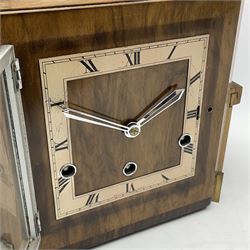 Art Deco period walnut grandmother/mantel clock, the removable mantel clock with square dial and silvered Roman chapter ring, triple train driven chiming movement, on later stand with book matched veneers