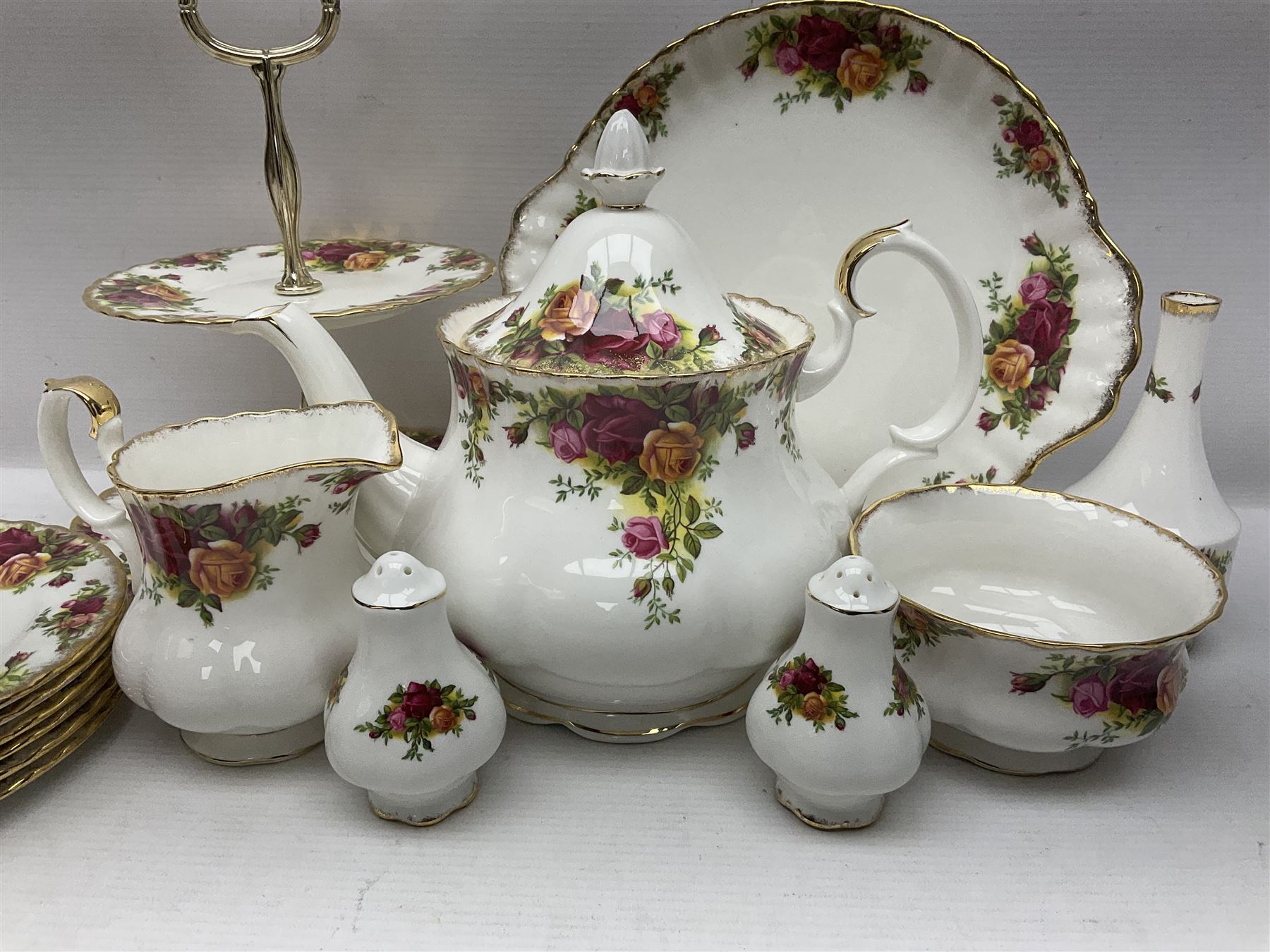 Royal Albert Old Country Roses pattern tea service for six, comprising teapot, sucrier, milk jug, dessert plates, one cake plate, one two tiered cake stand, salt and pepper pots and bud vase 