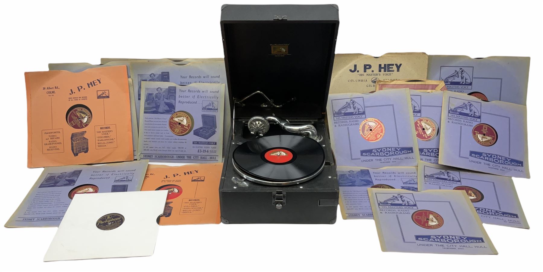 HMV portable wind up gramophone in a black case, together with a collection of records. 