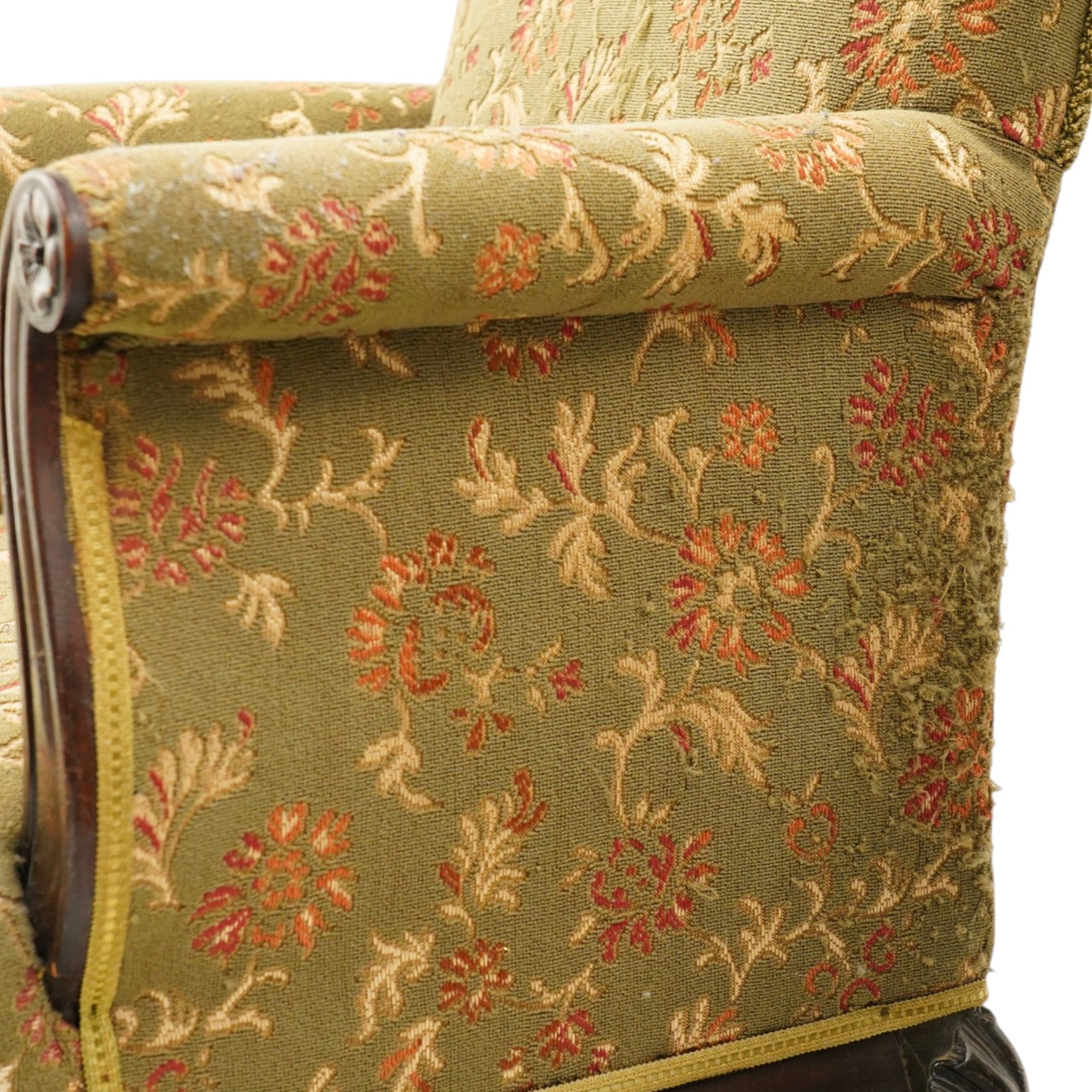 Pair of Chippendale design carved mahogany framed armchairs of stylised lyre form, high square backs and sprung seat upholstered in olive-ground foliate fabric, scrolled arm terminals with applied rosettes, the seat rail moulded with central scallop-and-acanthus motif, raised on shell-carved cabriole supports with ball-and-claw feet