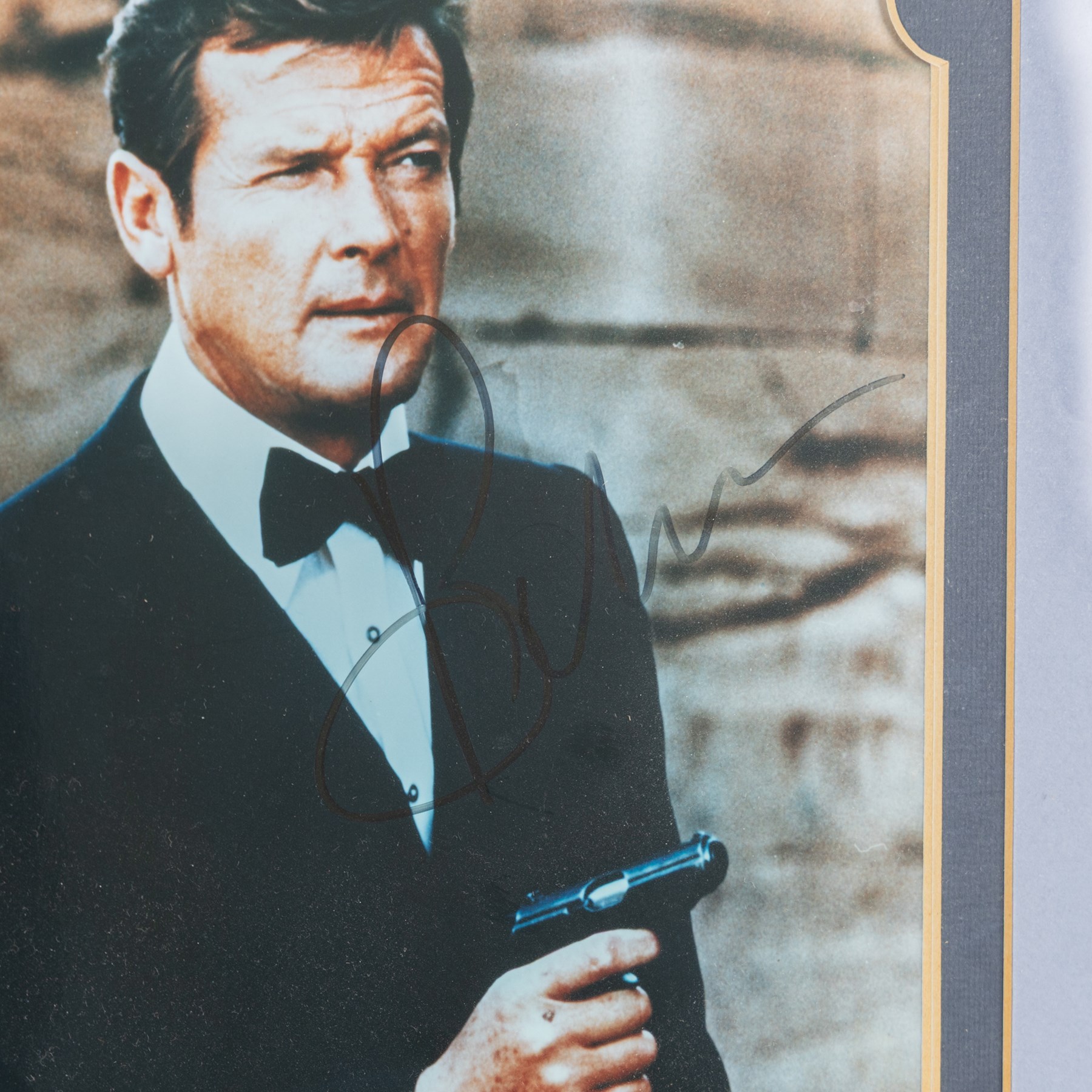 James Bond 40 years 20 films signed commemorative montage, comprising signed photographs of Sean Connery, George Lazenby, Roger Moore, Timothy Dalton and Pierce Brosnan, each with a certificate of authenticity from UACC Dealer Lester Freeman, framed, frame H79cm, W100cm