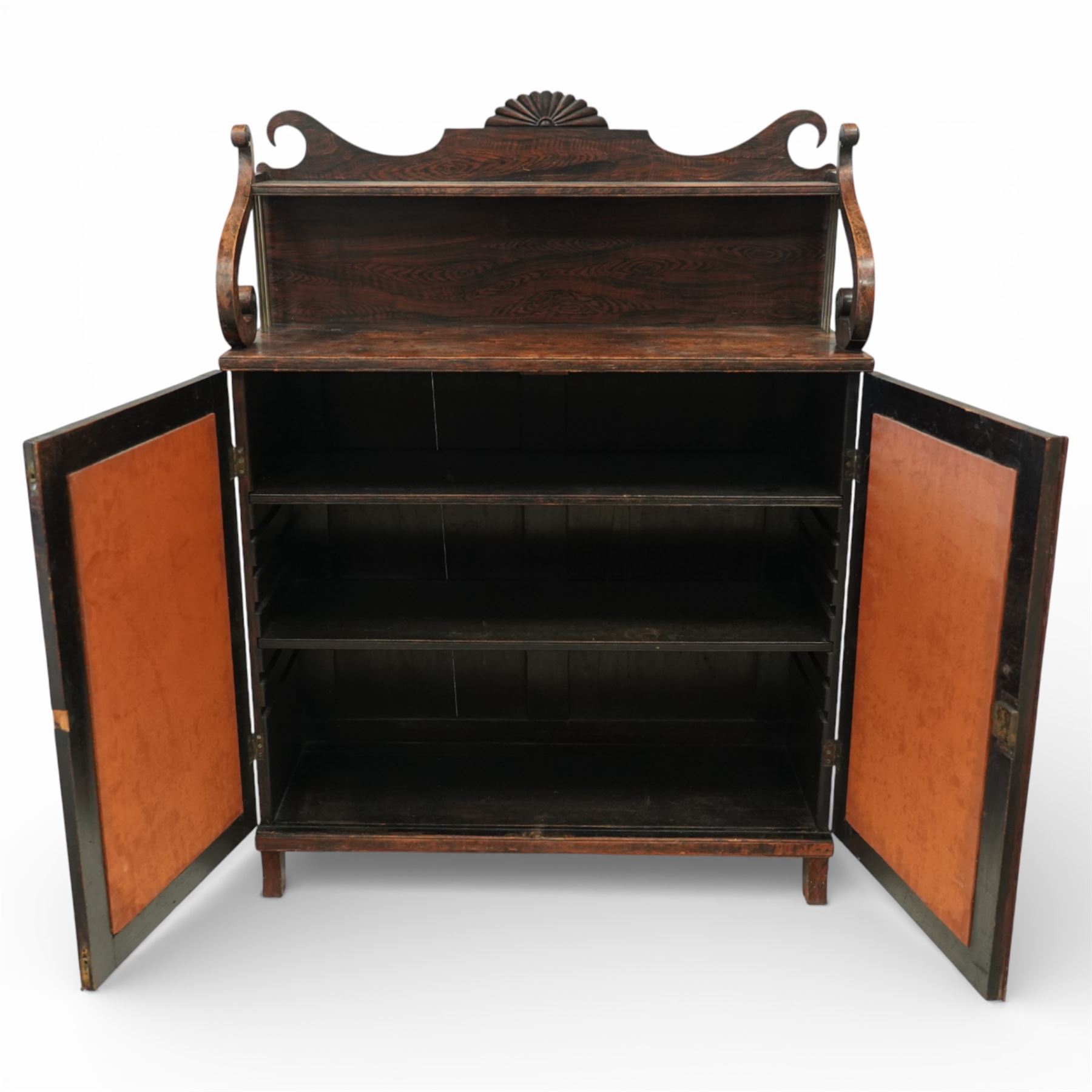 Regency simulated rosewood chiffonier, with shaped scroll supports and shell carved cresting, over a pair of panelled doors inset with diamond lattice glazing, enclosing a shelved interior, raised on short turned feet