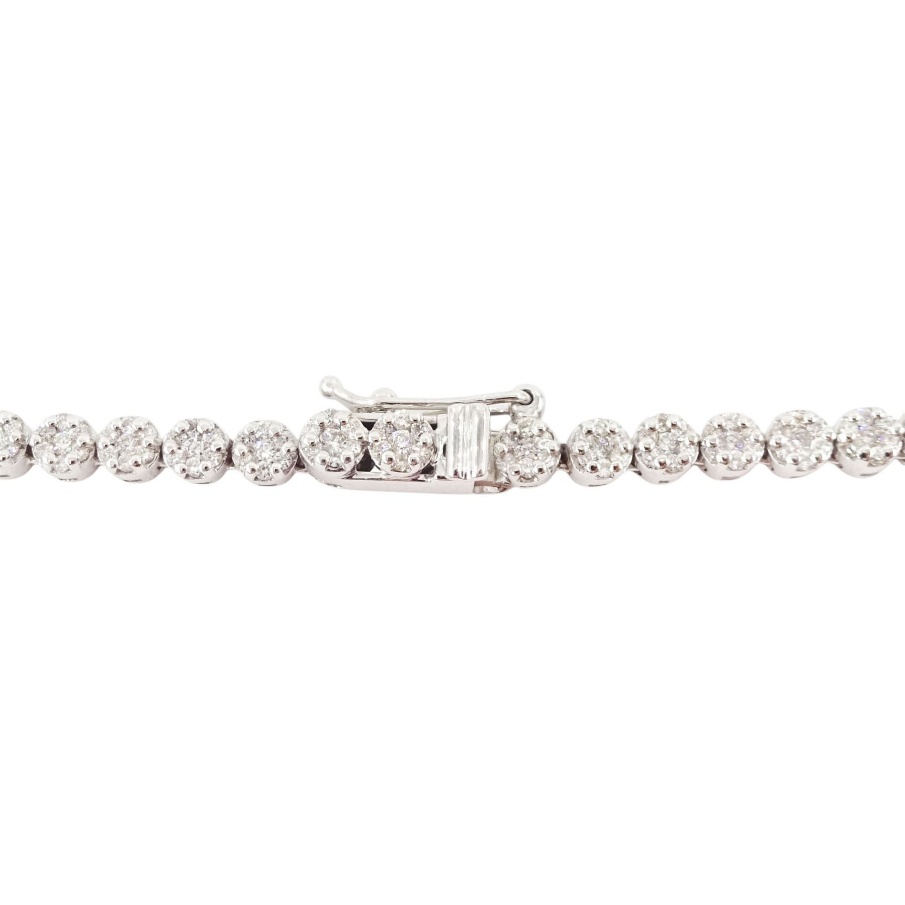18ct gold diamond necklace, one hundred fourteen clusters, each set with seven round brilliant cut diamonds, hallmarked, total diamond weight 5.00 carat, boxed with certificate