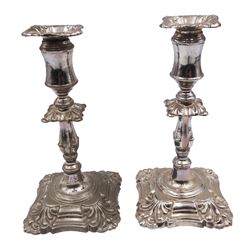 Pair of late Victorian silver mounted taper candlesticks, each of knopped and part fluted form, upon weighted square stepped base with anthemions to each corner, with conforming removable sconces, hallmarked Henry Wilkinson & Co, London 1891, H12cm