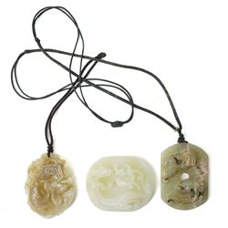 Set of three Chinese carved green hard stone pieces, depicting dragons and clouds, largest W5cm 