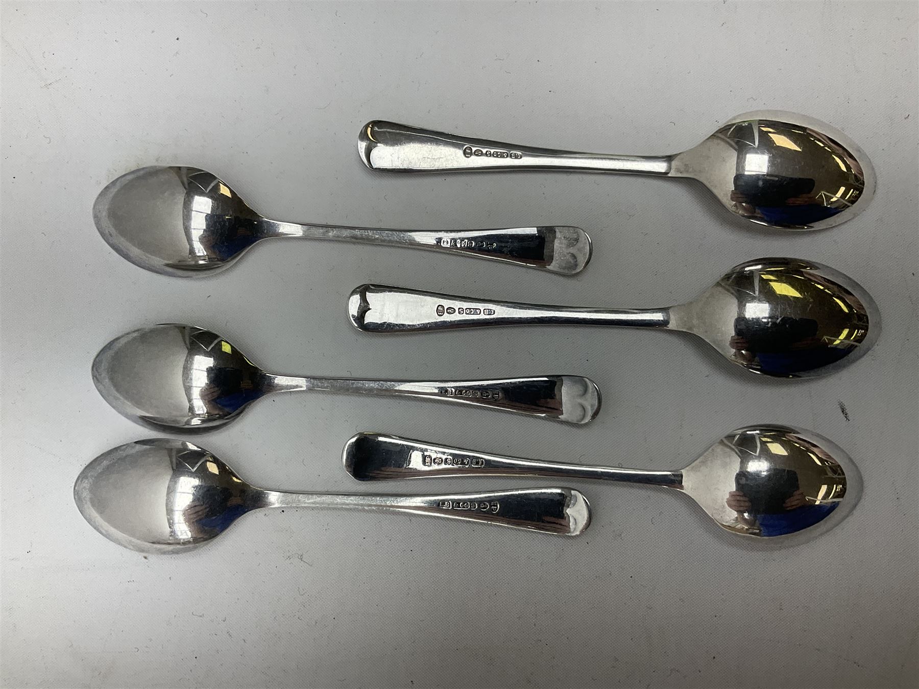 Set of three Yorkshire Miniature Rifle Association hallmarked silver and enamel fob medals, Birmingham 1925, 1926 & 1929; together with six silver plated coffee spoons each engraved with crossed rifles to the terminal (9)