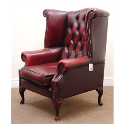  Georgian style wing back armchair, upholstered in deep buttoned Burgundy leather, cabriole legs (W90cm)  