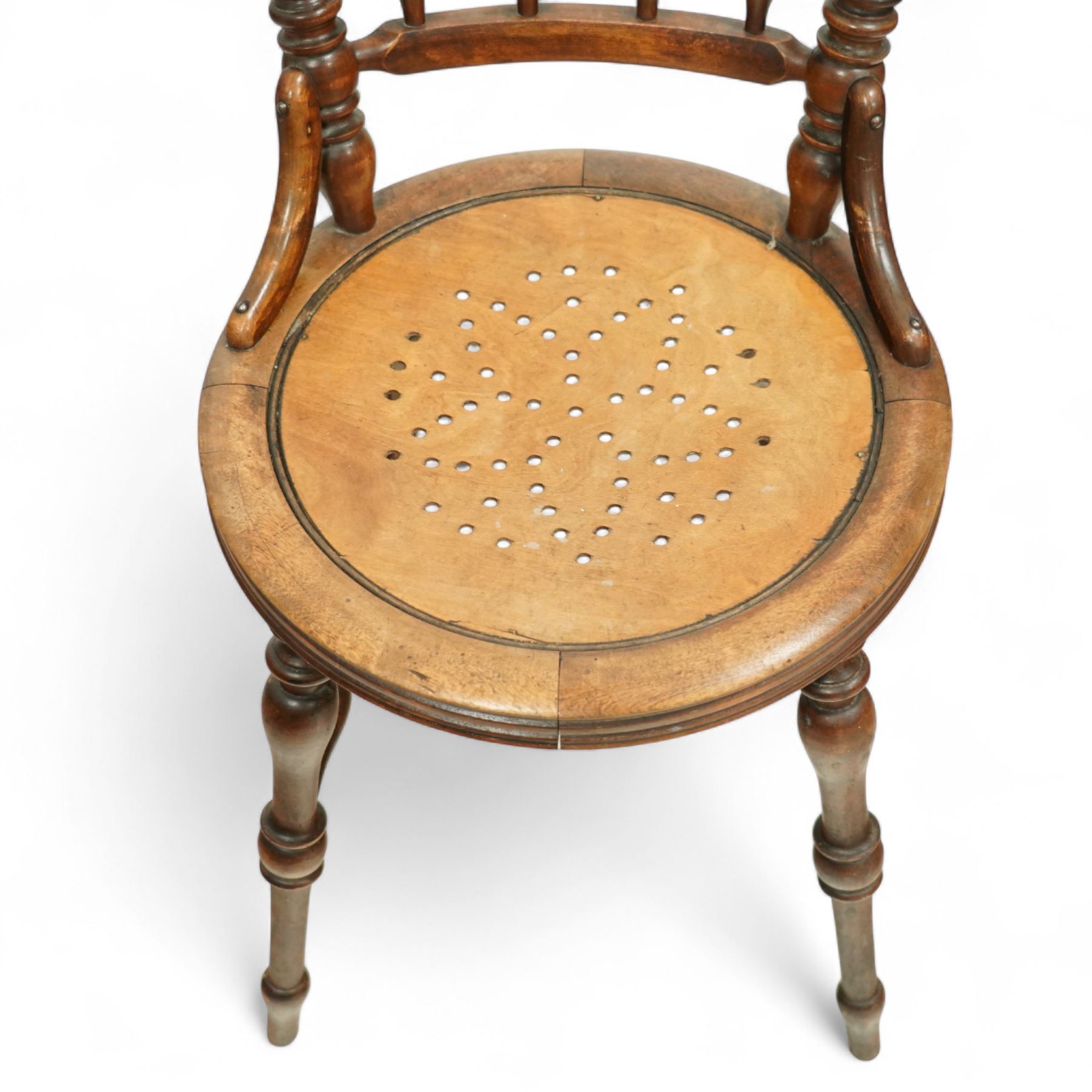 Early 18th century oak cradle dated AD 1710 and late 19th century kitchen chair, the cradle of pegged construction with shaped headboard and turned finials, raised on curved rockers (H 75cm, W 94cm, D 62cm), the chair with spindle back, turned supports and circular seat (H 89cm, W 42cm, D 47cm)