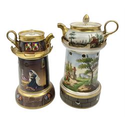 Two 19th century continental teapots and warmers, each teapot upon a cylindrical warming base in the form of a castle, hand printed with landscapes and figures in a religious pose, largest H22cm 