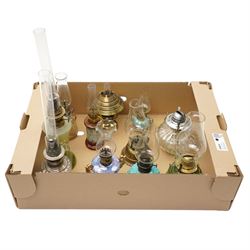 Small table oil lamp with painted glass base and various other small glass and ceramic oil lamps