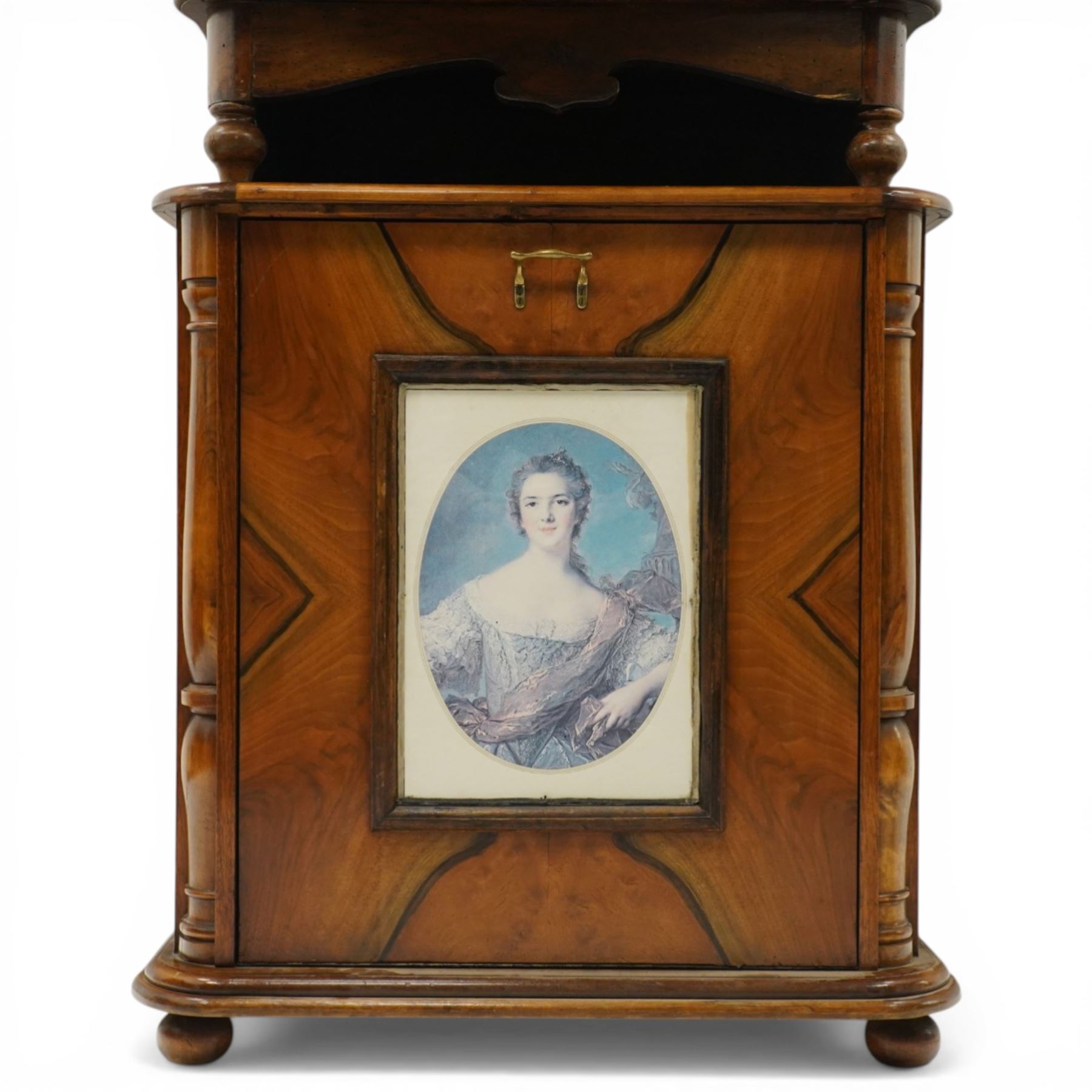 Late 19th century coin operated floor standing Polyphon, the shaped cornice marked 'Polyphon' with eleven 50cm discs in a walnut case with glazed upper section, the coin slot marked '1 Penny', the lower section with fall front for disc storage and inset with a portrait print and on compressed bun feet H230cm x W76cm x D46cm with a number of old pennies
