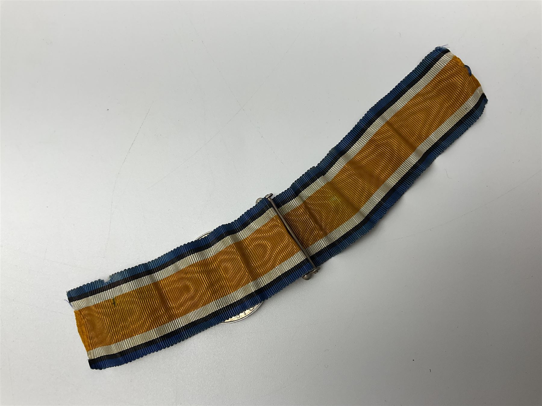 WW2 German Luftwaffe Mess cutlery comprising table spoon and fork, each with H.M.Z.38 mark; WW1 British War Medal awarded to L-13858 Gnr. J. McCabe R.A.; and small quantity of military badges, rank pips etc