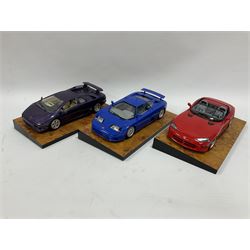 Three The Crestley Collection 1:18 scale model cars comprising Dodge Viper (1992), Lamborghini Diablo (1990) and Bugatti EB 110 (1991) mounted on heavy wood effect plinth bases, all with certificates
