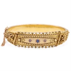 Early 20th century 9ct gold sapphire and diamond three stone hinged bangle, with fancy wir...