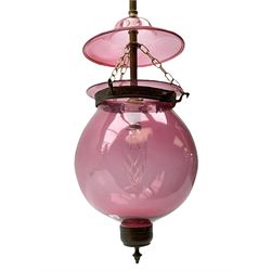 Late Victorian cranberry glass ceiling shade, of bulbous form with domed cover and metal mounts, shade without cover H30cm