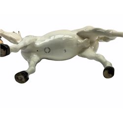 Beswick horse figures, comprising Highland Pony 1644, and another, probably Aran Bahram in grey, each with printed mark beneath.
