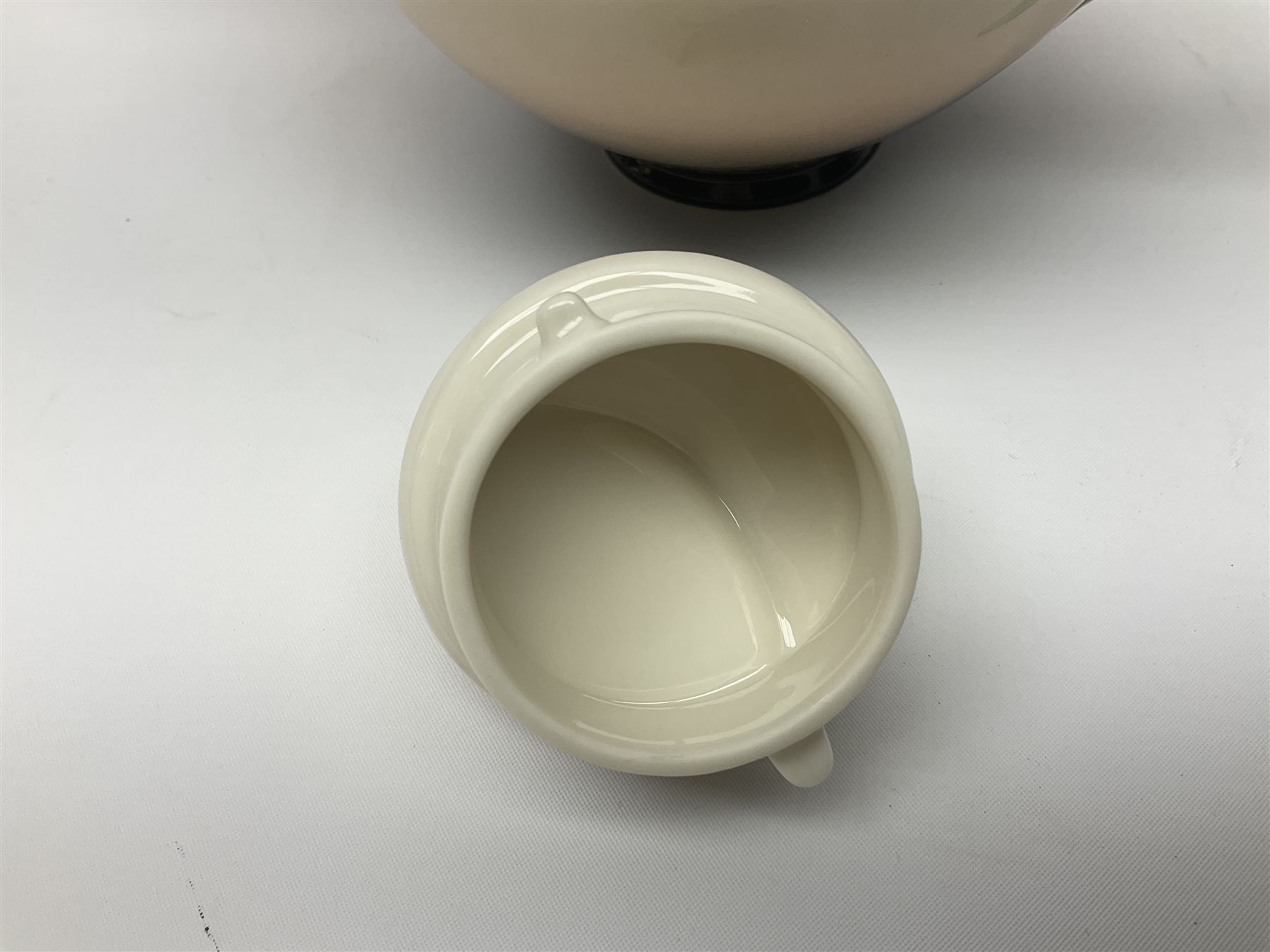 Franz Teapot decorated with dragonflies, together with a matching sucrier and cover and a cup and saucer in Iris pattern, all with printed mark beneath 