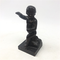  18th/ 19th century carved model of a Cherub standing with one arm raised, square base H19cm and 19th century carved oak Pilaster in the form of a gentleman H49cm   