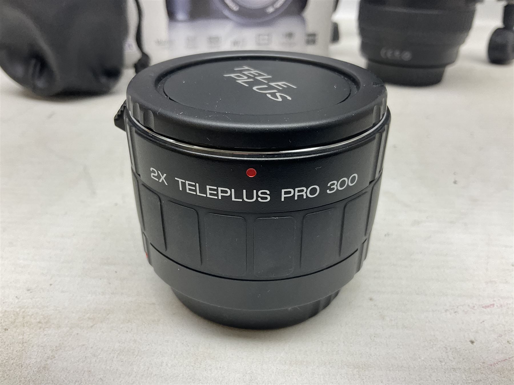 Canon Eos 7D camera body, serial number 3261306344, with 'Canon Ultrasonic EF 24-105mm Macro 0.45m/1.5ft Ultrasonic' Lens, 'Canon Zoom EF 75-300, 1;4-5.6 III' lens and Teleplus Pro 300 lens, together with tripod and original camera box 