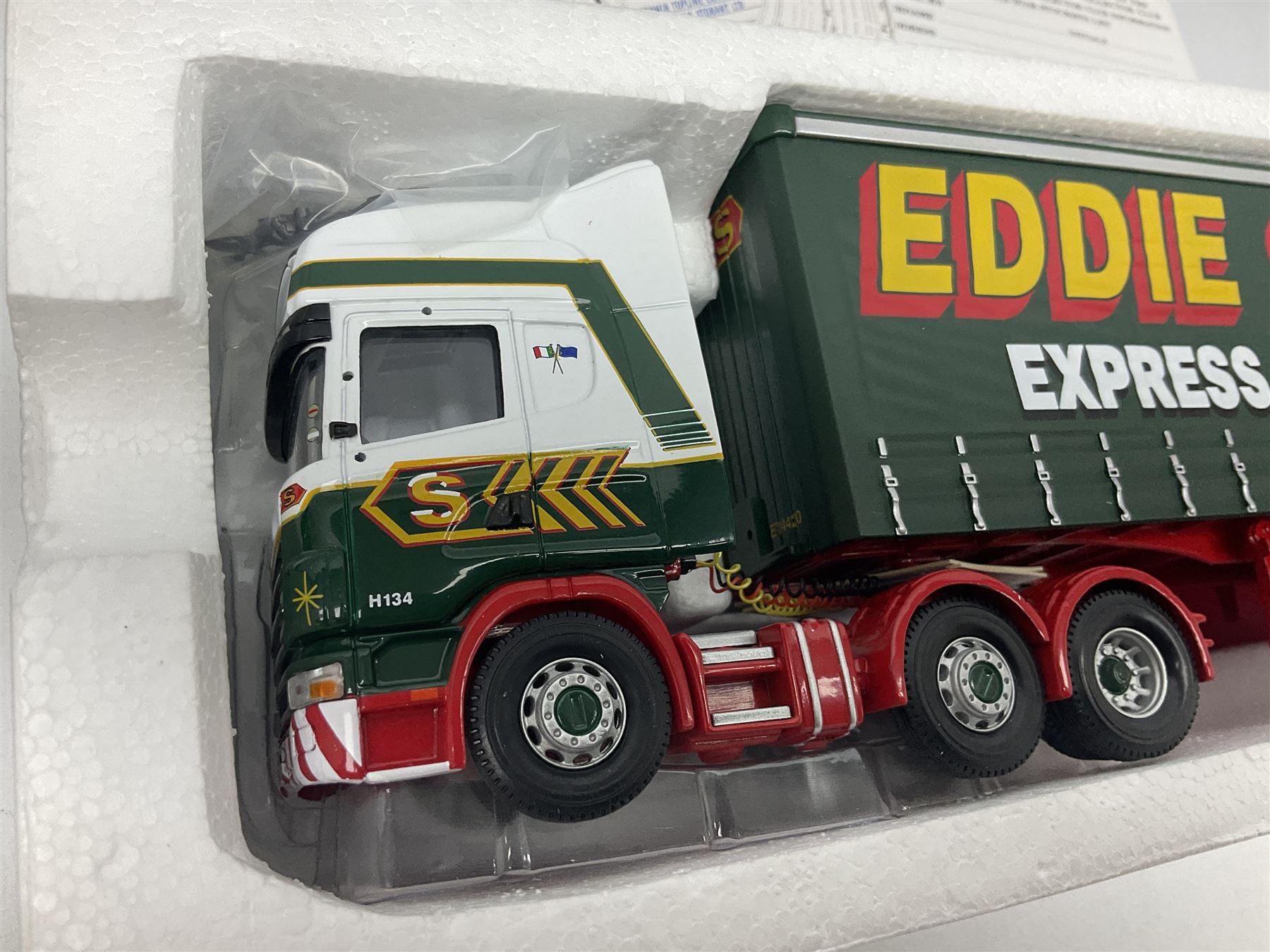 Corgi Eddie Stobart - three limited edition lorries; CC12901 Scania Topline Curtainside; CC13101 Volvo F88 Box Trailer; and CC13207 DAF XF Space Cab & Flatbed Trailer; all boxed (3)