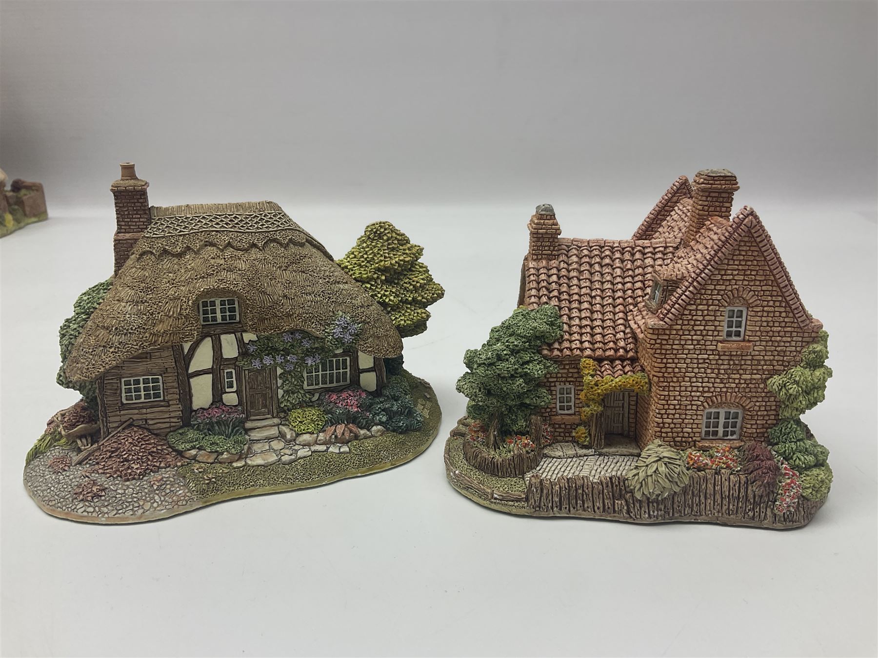 Ten Lilliput Lanes, comprising from Midlands Region Witham Delph, Jun and Disorderly, From South West Region Puffin Row, Moonlight Cove, The Cuddy, and from South West Region, The Rustlings, Saxton Cottage (1988), Marigold Meadow, Calendar Cottage and Little Lupins, all with boxes and deeds 