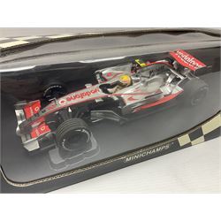 Three Minichamps 1:18 scale die-cast McLaren racing cars - Mercedes MP4-19 D. Coulthard; Mercedes MP4-20 K. Raikkonen; and Vodaphone Mercedes MP4-22 L. Hamilton 2007; all boxed (3)

