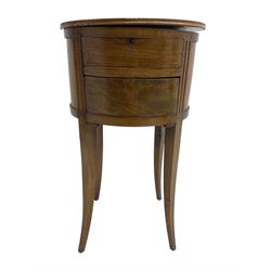 19th century mahogany circular work table, hinged lid concealing top compartment and button to release secret drawer, fluted uprights, raised on tapered sabre supports